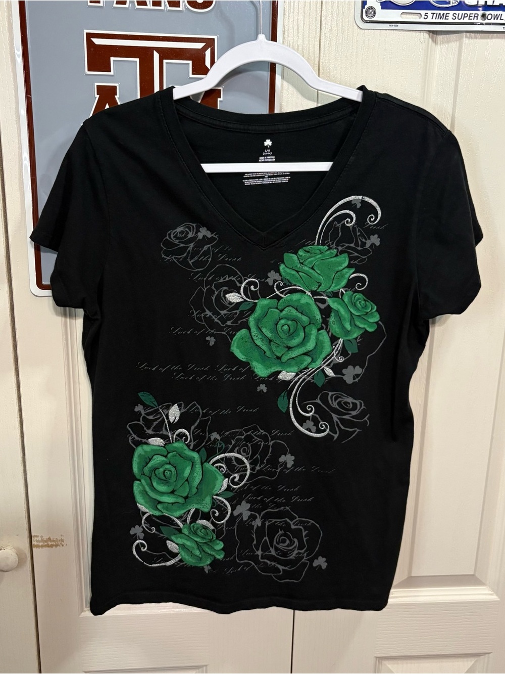 Lucky Shamrock Women's Black V-Neck Tee with Green Rose Graphic